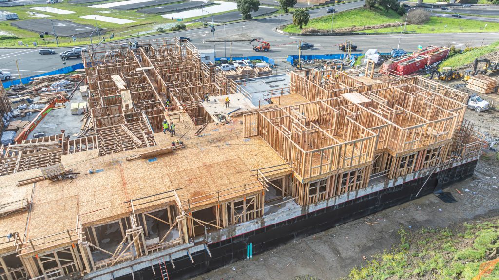 Wooden building frame under development with horizontal and vertical support beams
