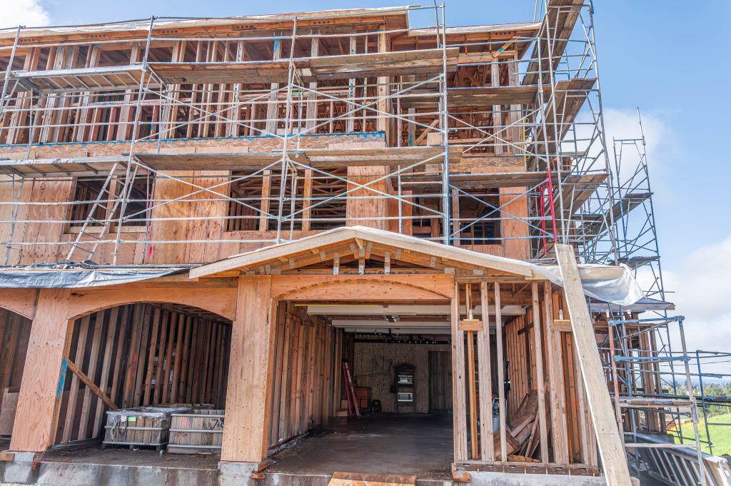 Partially completed timber framework showcasing wooden supports and bracing