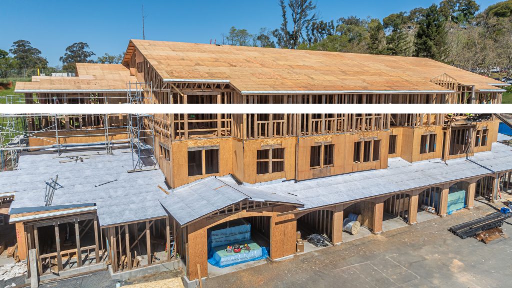 Timber construction featuring a framework of wooden beams and vertical supports