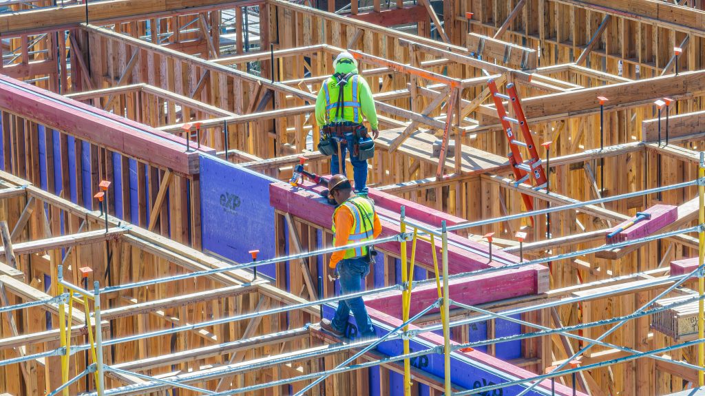 Timber framework showing vertical posts and horizontal beams during the early stages of construction