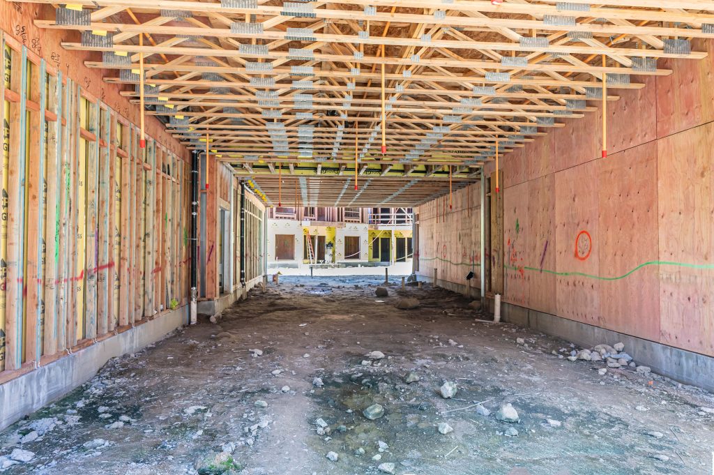 Undergoing construction wooden frame with timber supports and framework partially assembled