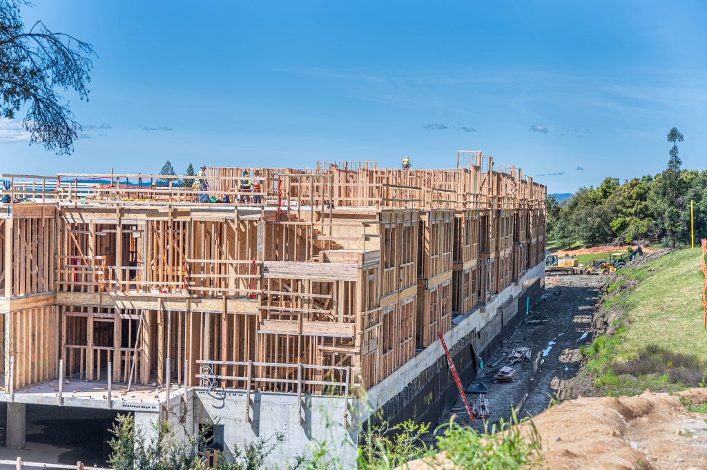Close-up of a wooden frame with detailed joinery and timber supports during construction.