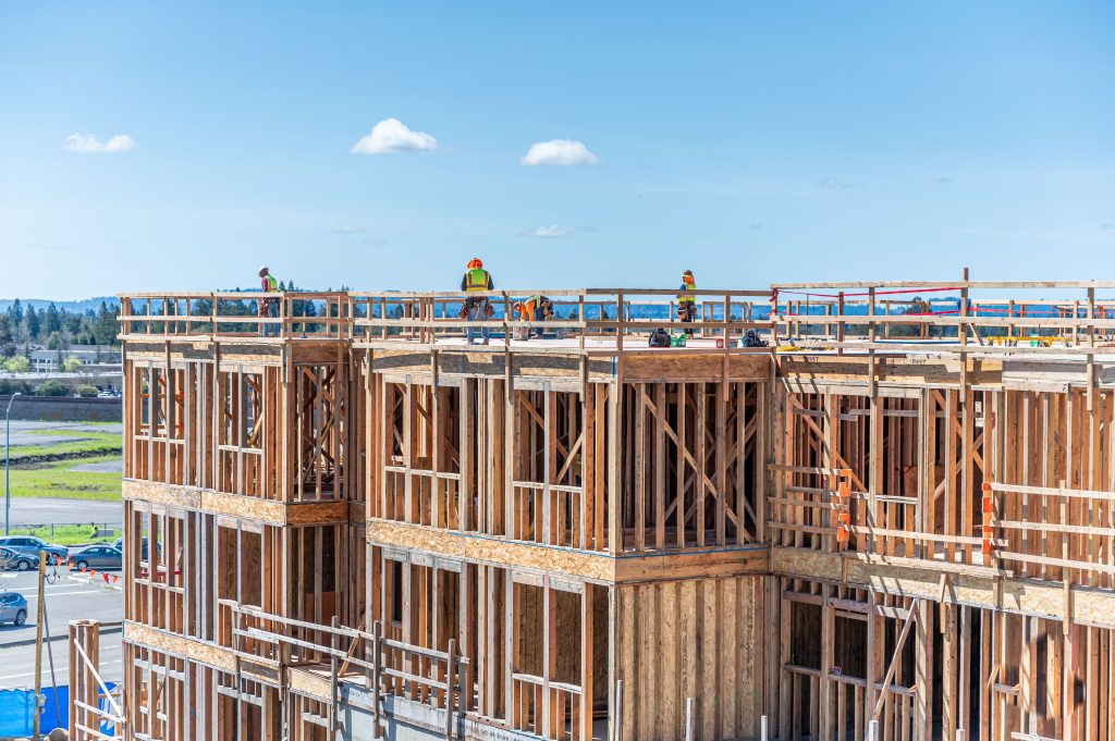 Partially completed wooden frame showcasing vertical and horizontal timber elements