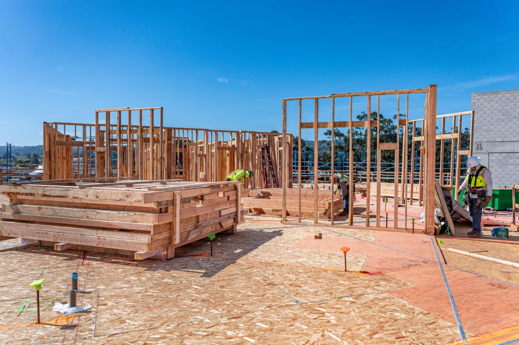 Timber frame construction with partially assembled walls and exposed wooden supports